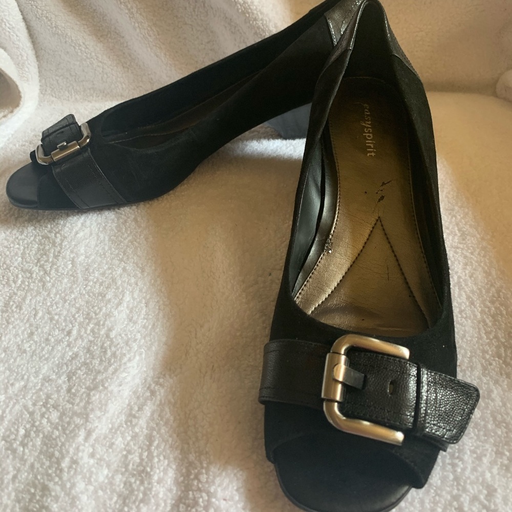 Wedge open toed black suede heels.